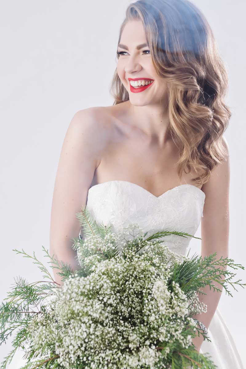 bridal smiling bridal beauty ideas red lip hair down winter bridal bouquet