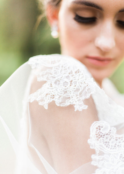 close up of bride and chantilly lace on veil