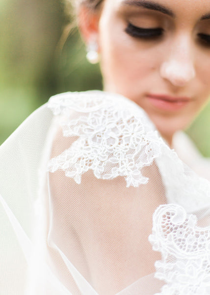 close up of bride and chantilly lace on veil